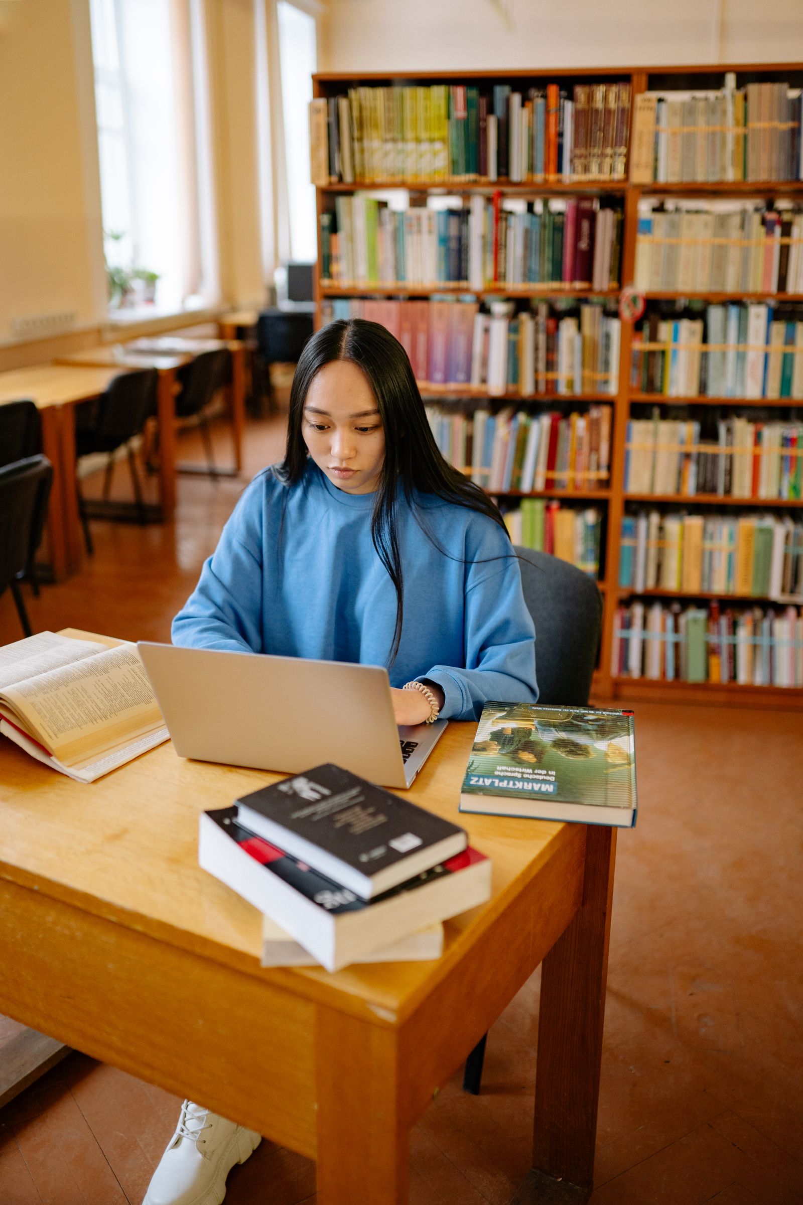 A member exploring learning materials on their laptop