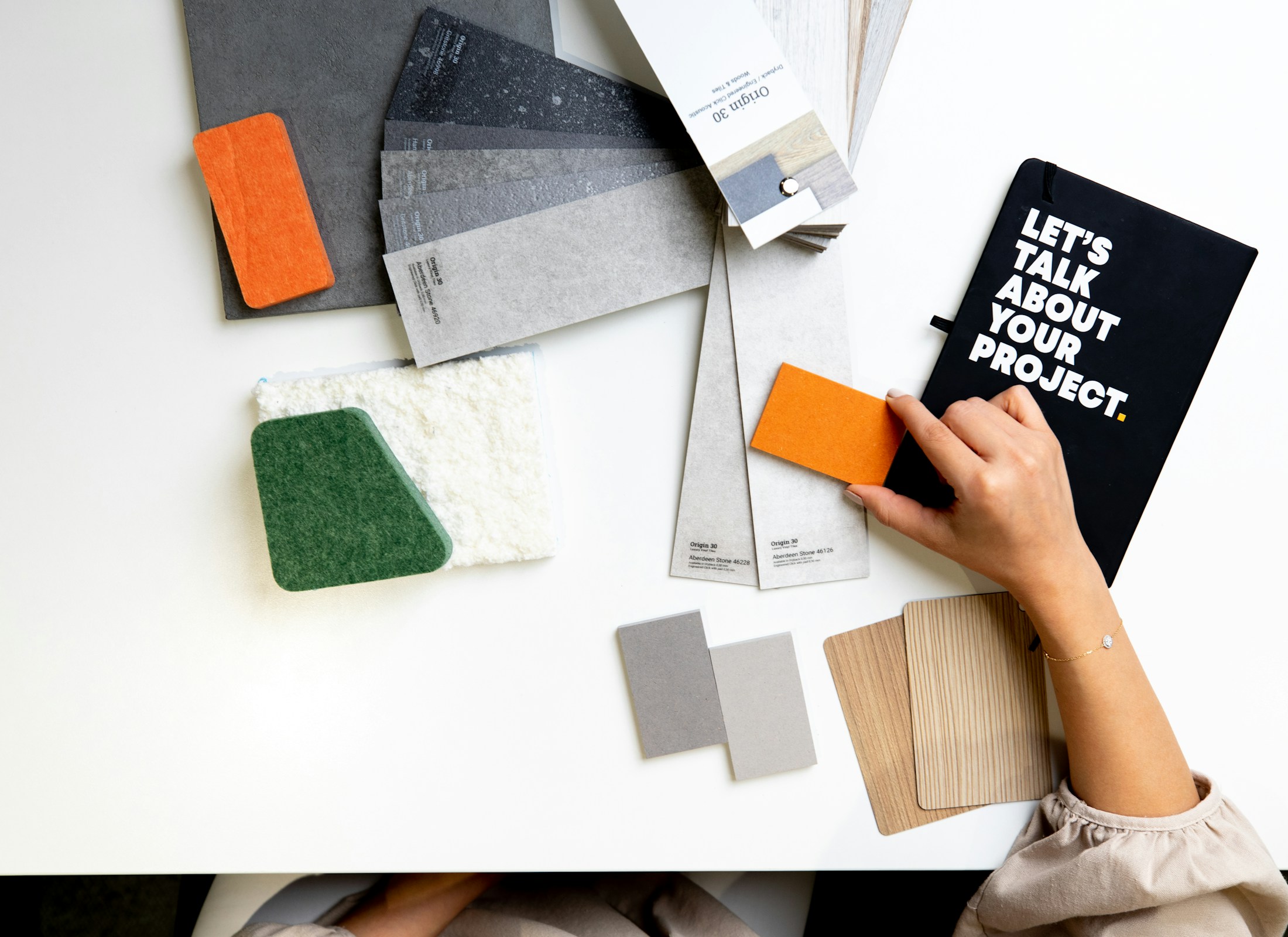 Color swatches and creative materials being arranged for a new collection